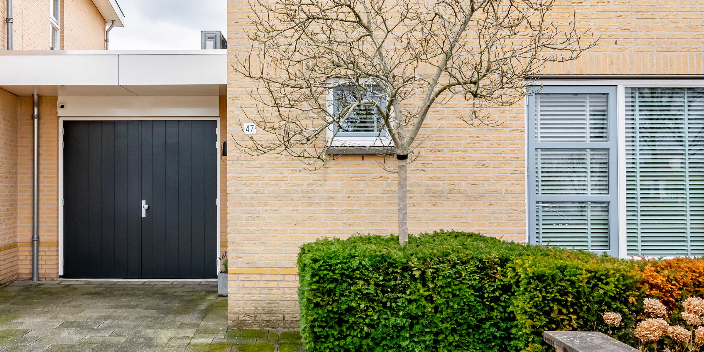 Houten garagedeur openslaand