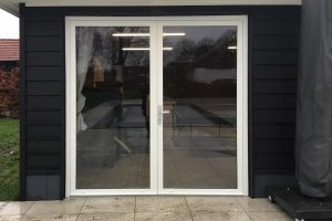 openslaande garagedeur van glas